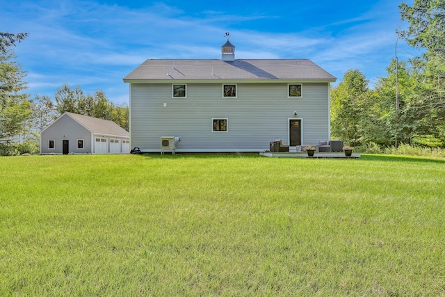 back of property featuring central AC and a lawn