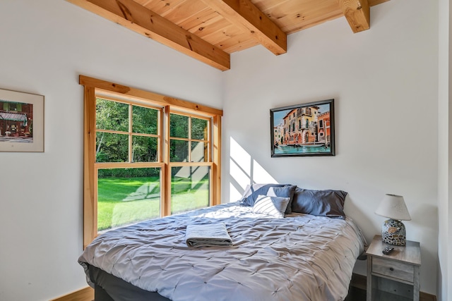 bedroom featuring beamed ceiling and wood ceiling