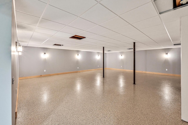 basement featuring a paneled ceiling