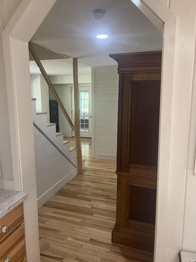63 Rebel Hill Rd, Merrill, ME 04780 - corridor featuring stairs and light wood-style floors