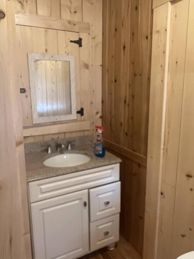63 Rebel Hill Rd, Merrill, ME 04780 - bathroom with wooden walls and vanity