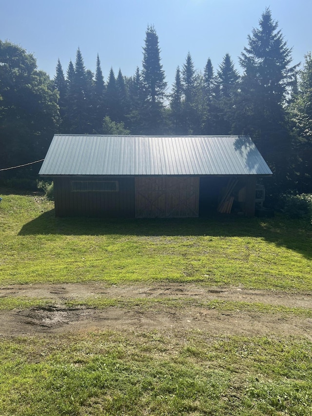 63 Rebel Hill Rd, Merrill, ME 04780 - exterior space featuring a wooded view and a yard