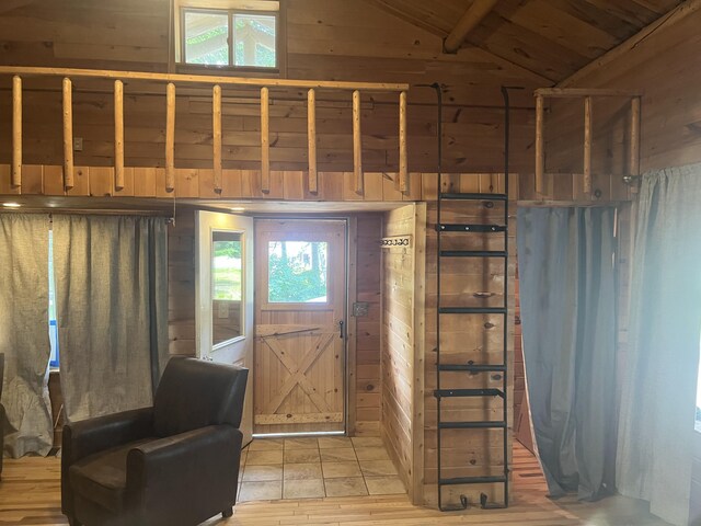 63 Rebel Hill Rd, Merrill, ME 04780 - entryway with wooden walls, wood ceiling, and lofted ceiling