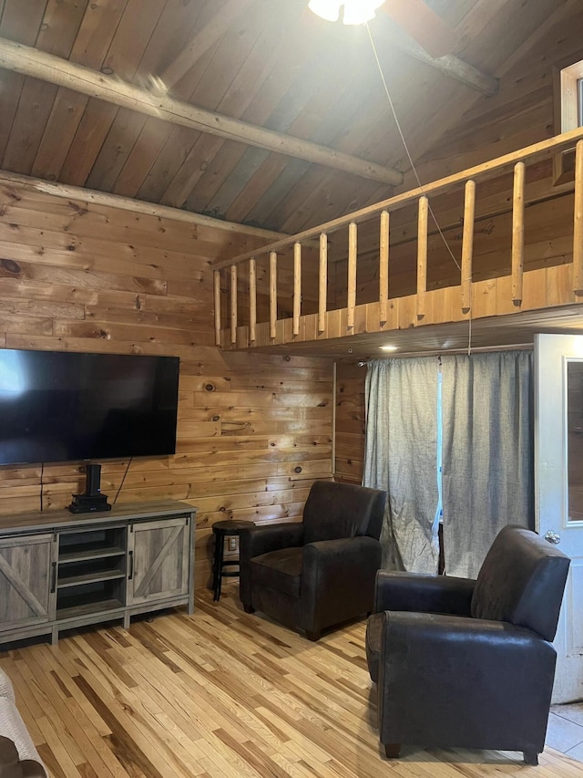 63 Rebel Hill Rd, Merrill, ME 04780 - living area with light wood-type flooring, wood ceiling, wood walls, and vaulted ceiling