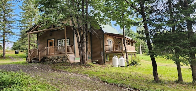 63 Rebel Hill Rd, Merrill, ME 04780 - view of side of property with a yard and a porch