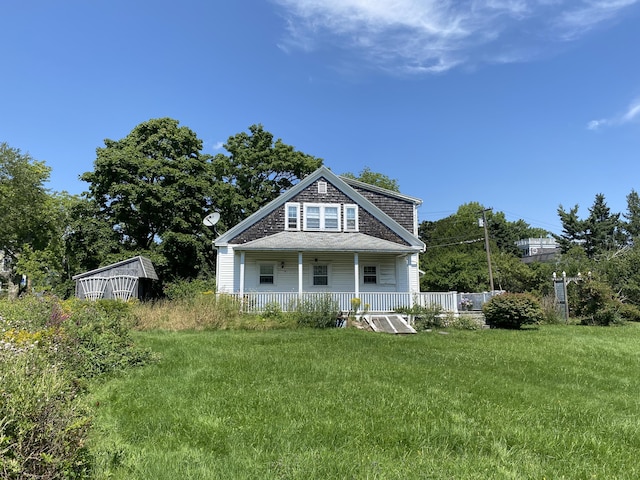 exterior space with a porch and a yard