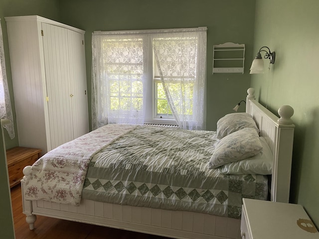 bedroom with wood-type flooring