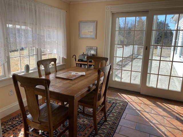 dining area with tile patterned floors and a wealth of natural light