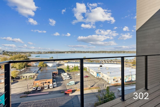 balcony featuring a water view