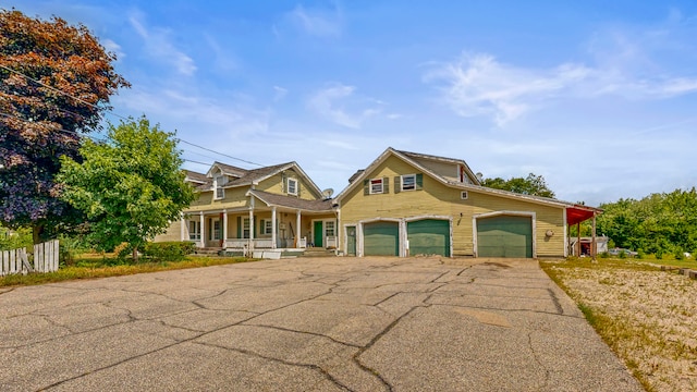 view of front of property featuring a porch and a garage