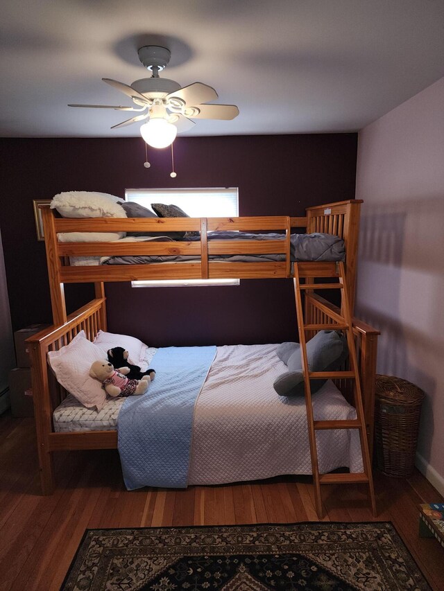 bedroom with hardwood / wood-style flooring and ceiling fan