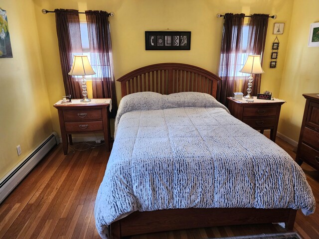 bedroom featuring dark hardwood / wood-style floors and a baseboard radiator