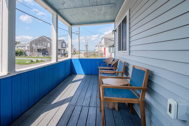 unfurnished sunroom with a residential view