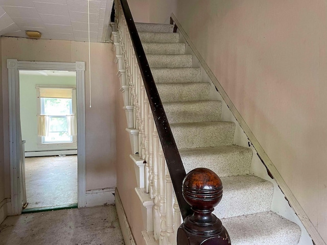 stairs with baseboard heating