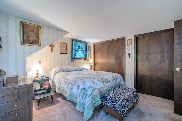 carpeted bedroom with two closets