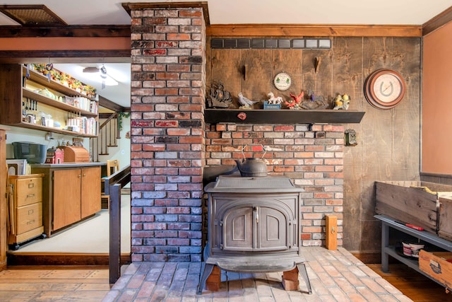 interior details featuring wood-type flooring and a wood stove