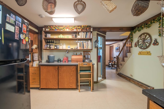 bar with black fridge, a baseboard radiator, and light tile patterned floors