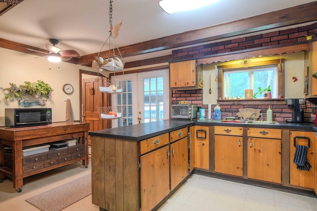 kitchen with light tile patterned flooring, ceiling fan, a healthy amount of sunlight, and french doors