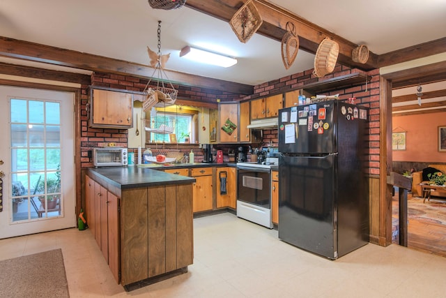 kitchen featuring light tile patterned floors, white electric range oven, a healthy amount of sunlight, and black fridge