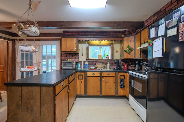 kitchen with a wealth of natural light, backsplash, and electric range