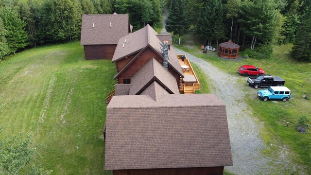 61 Sawyer Pond Highlands, Greenville, ME 04441 - drone / aerial view featuring a wooded view