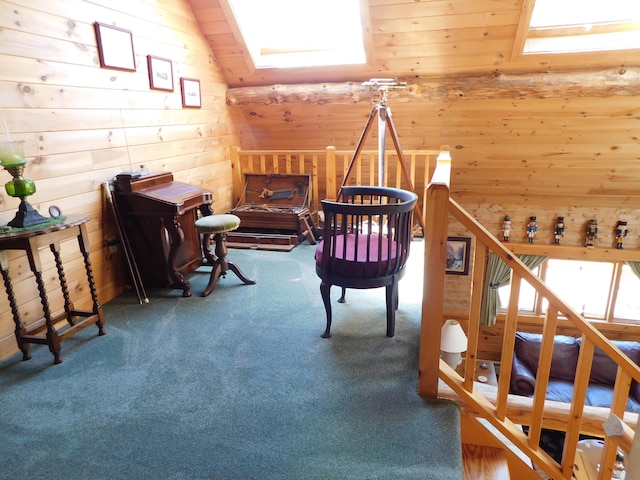 interior space with wooden ceiling, lofted ceiling with skylight, carpet flooring, and wood walls