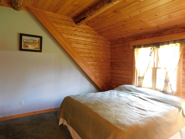 bedroom featuring lofted ceiling with beams, carpet, and wooden ceiling