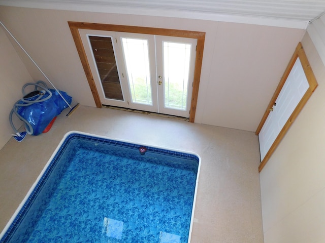 view of pool featuring french doors