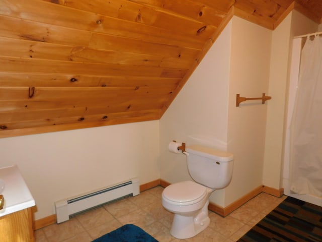 bathroom with baseboard heating, tile patterned floors, vanity, and toilet