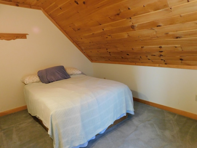 bedroom with wooden ceiling, carpet, and lofted ceiling