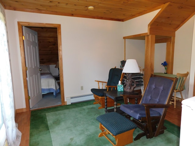 living area featuring hardwood / wood-style floors, baseboard heating, and wooden ceiling