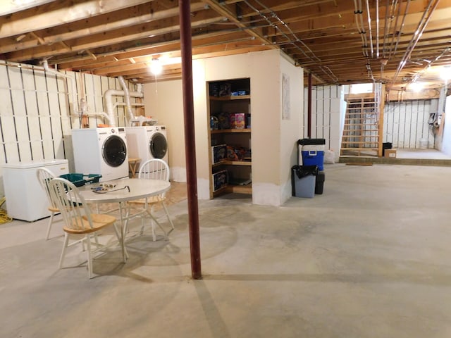 basement with washer and clothes dryer