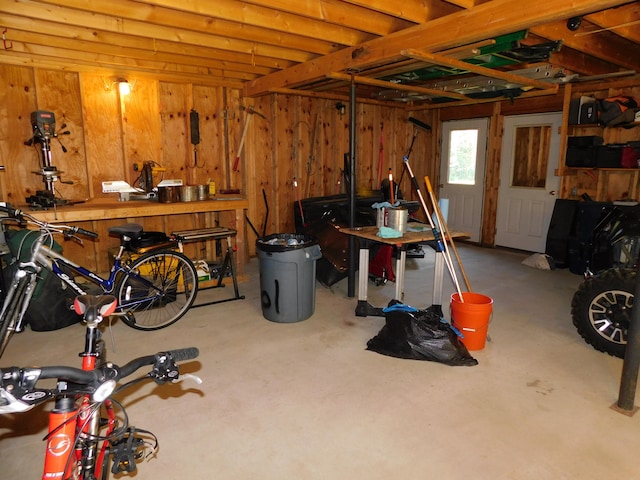 garage featuring wooden walls