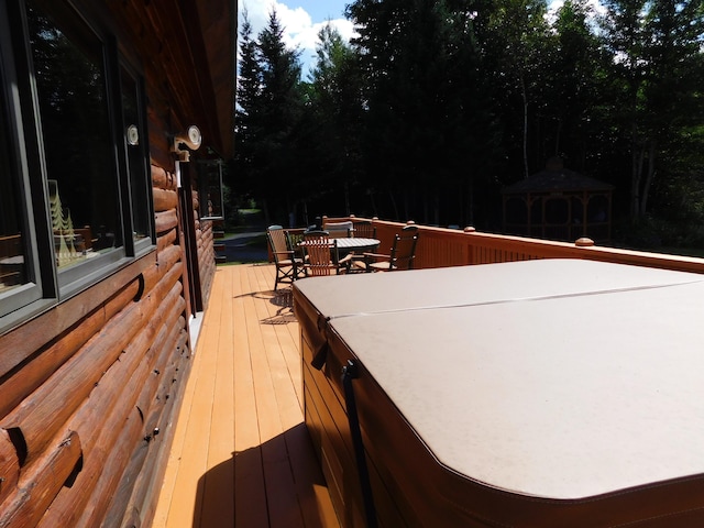 61 Sawyer Pond Highlands, Greenville, ME 04441 - wooden terrace featuring a gazebo and outdoor dining area