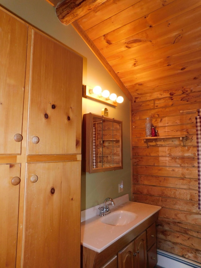 bathroom featuring baseboard heating, vanity, lofted ceiling, and wood ceiling