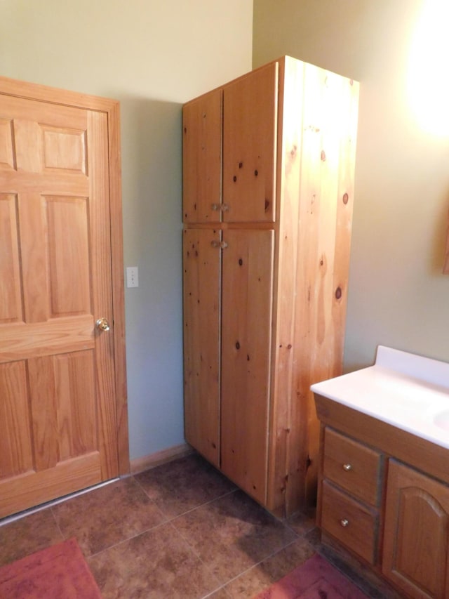 bathroom featuring tile patterned floors and vanity