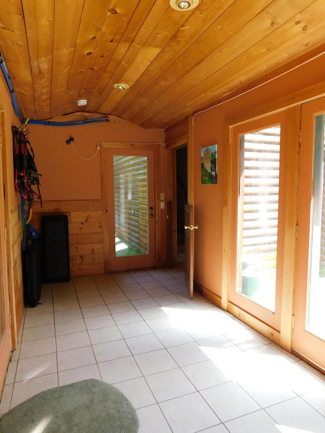 interior space featuring lofted ceiling and wood ceiling