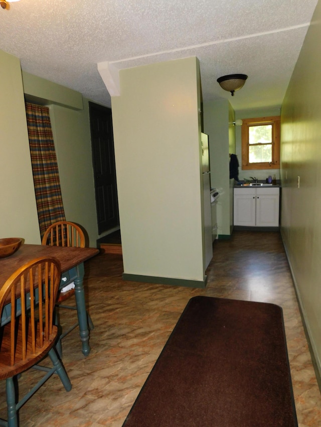 interior space with a textured ceiling