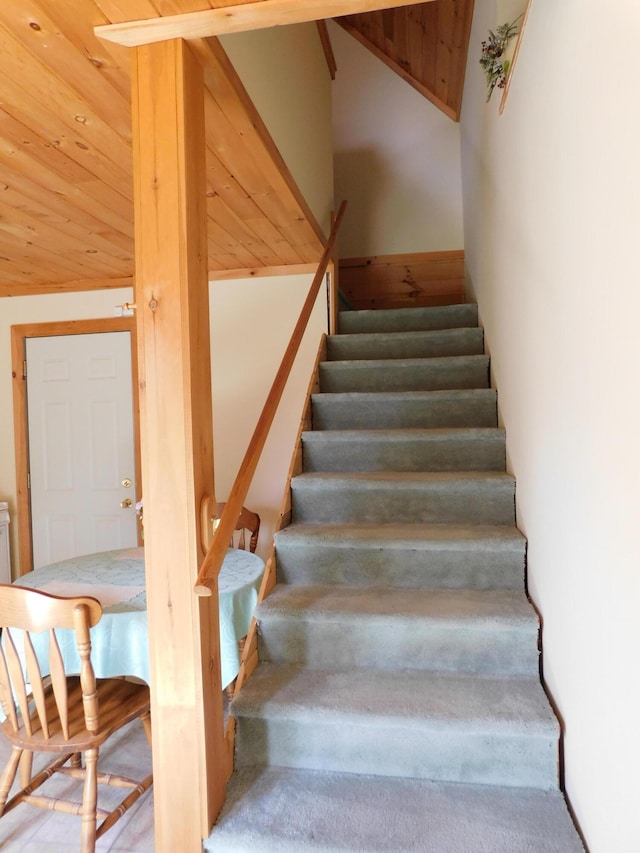 stairway with lofted ceiling and wood ceiling