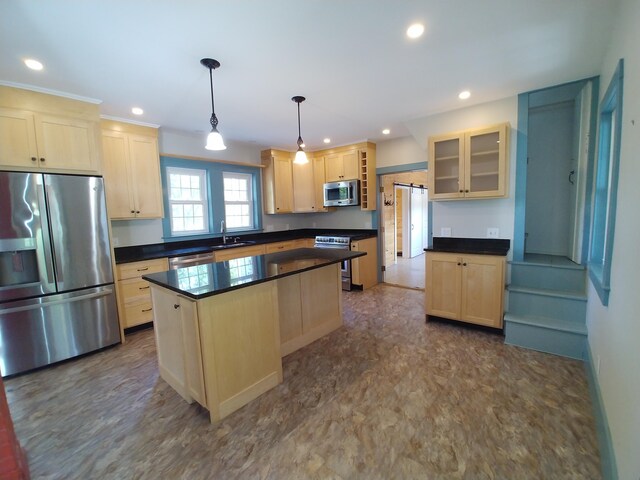 kitchen with a kitchen island, hanging light fixtures, stainless steel appliances, sink, and light brown cabinets