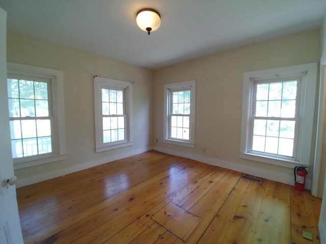 unfurnished room with light hardwood / wood-style floors