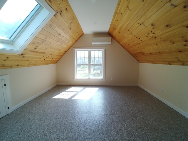 bonus room featuring a wall unit AC, lofted ceiling with skylight, carpet, and wooden ceiling