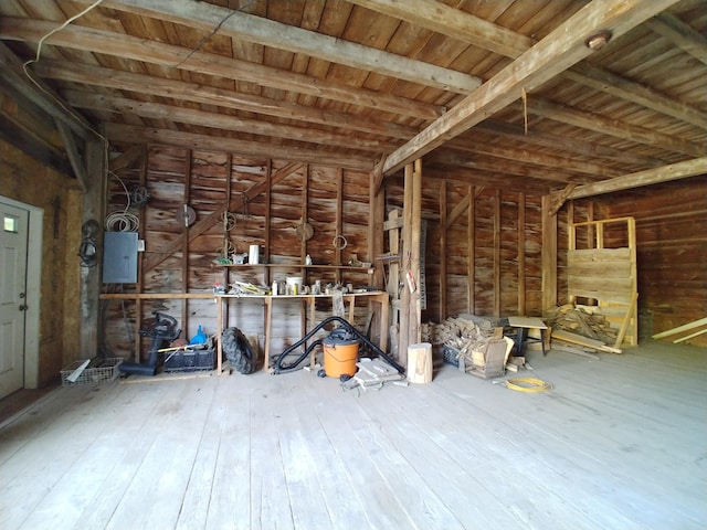 misc room featuring hardwood / wood-style floors and electric panel