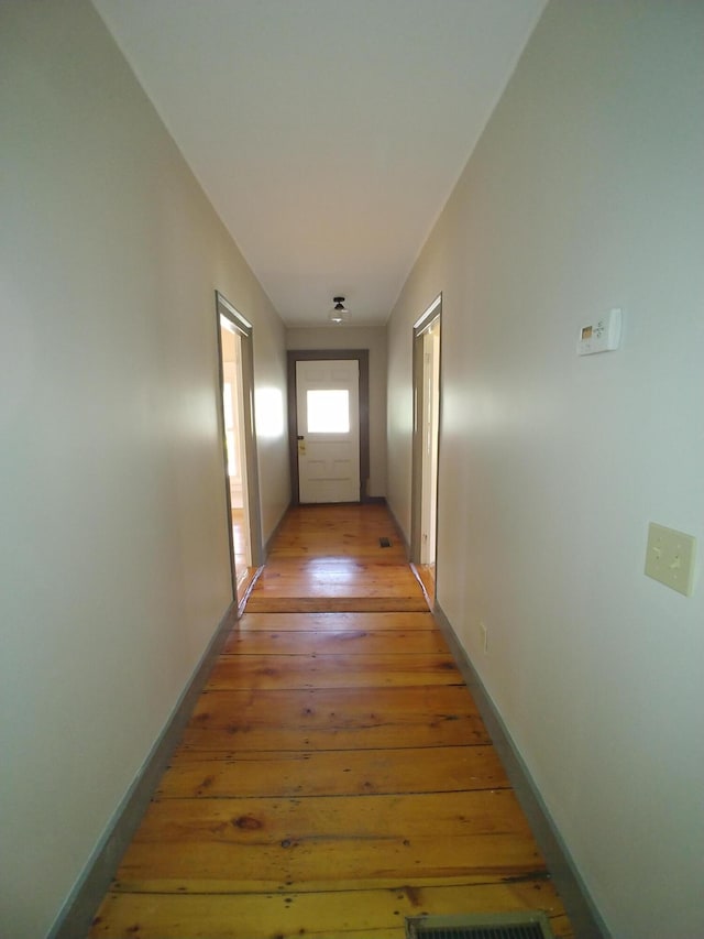 hallway featuring light hardwood / wood-style floors