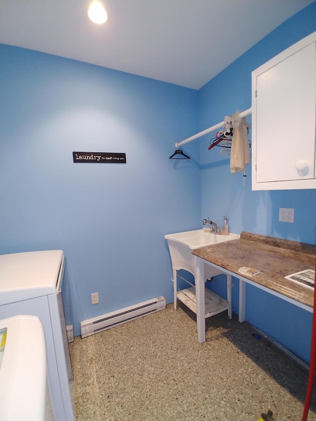 laundry room featuring a baseboard heating unit