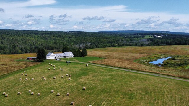 birds eye view of property with a water view and a rural view