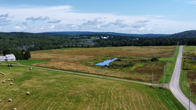 birds eye view of property featuring a rural view