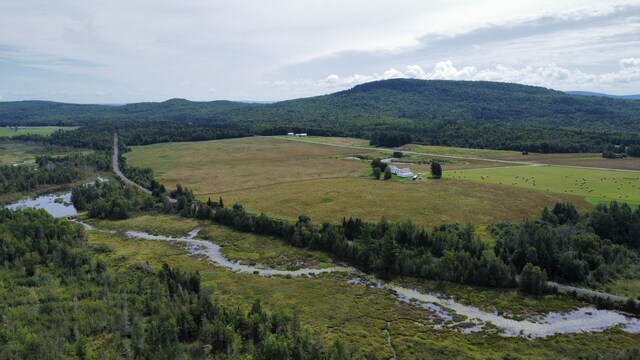 mountain view featuring a rural view