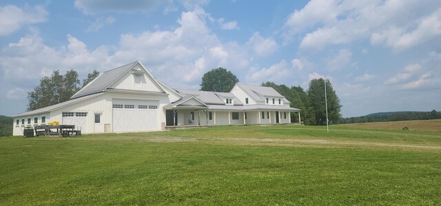 view of front of home with a garage and a front yard