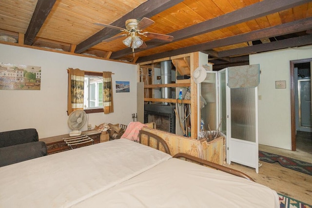 bedroom featuring beam ceiling and wood ceiling